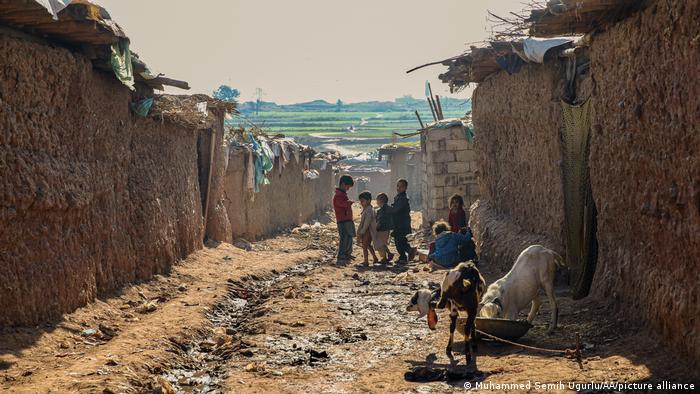 Afghan refugee children are seen at Afghan Basti refugee camp on a winter day outside Islamabad, Pakistan